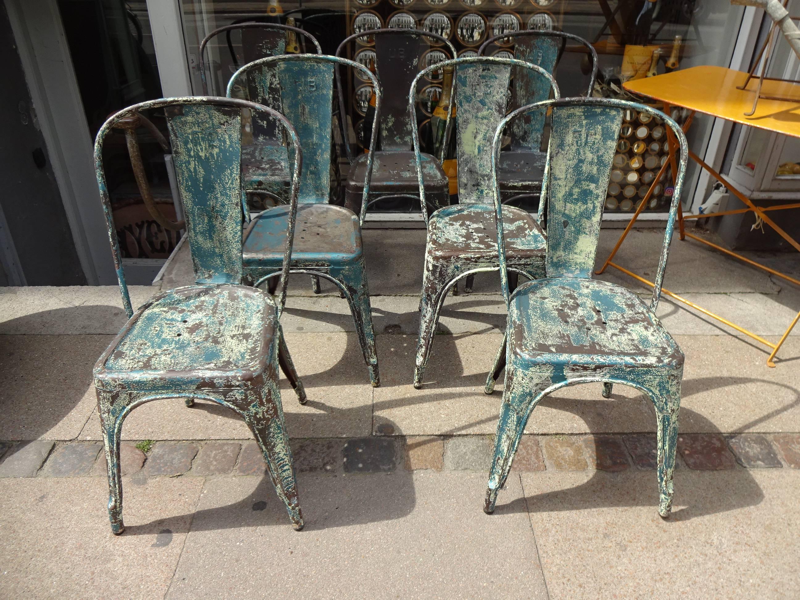Vintage French Tolix chairs, designed by Xavier Pouchard. Metal, with fragments of the original blue/green color. Super patina.
We currently have eight pieces in stock.
 