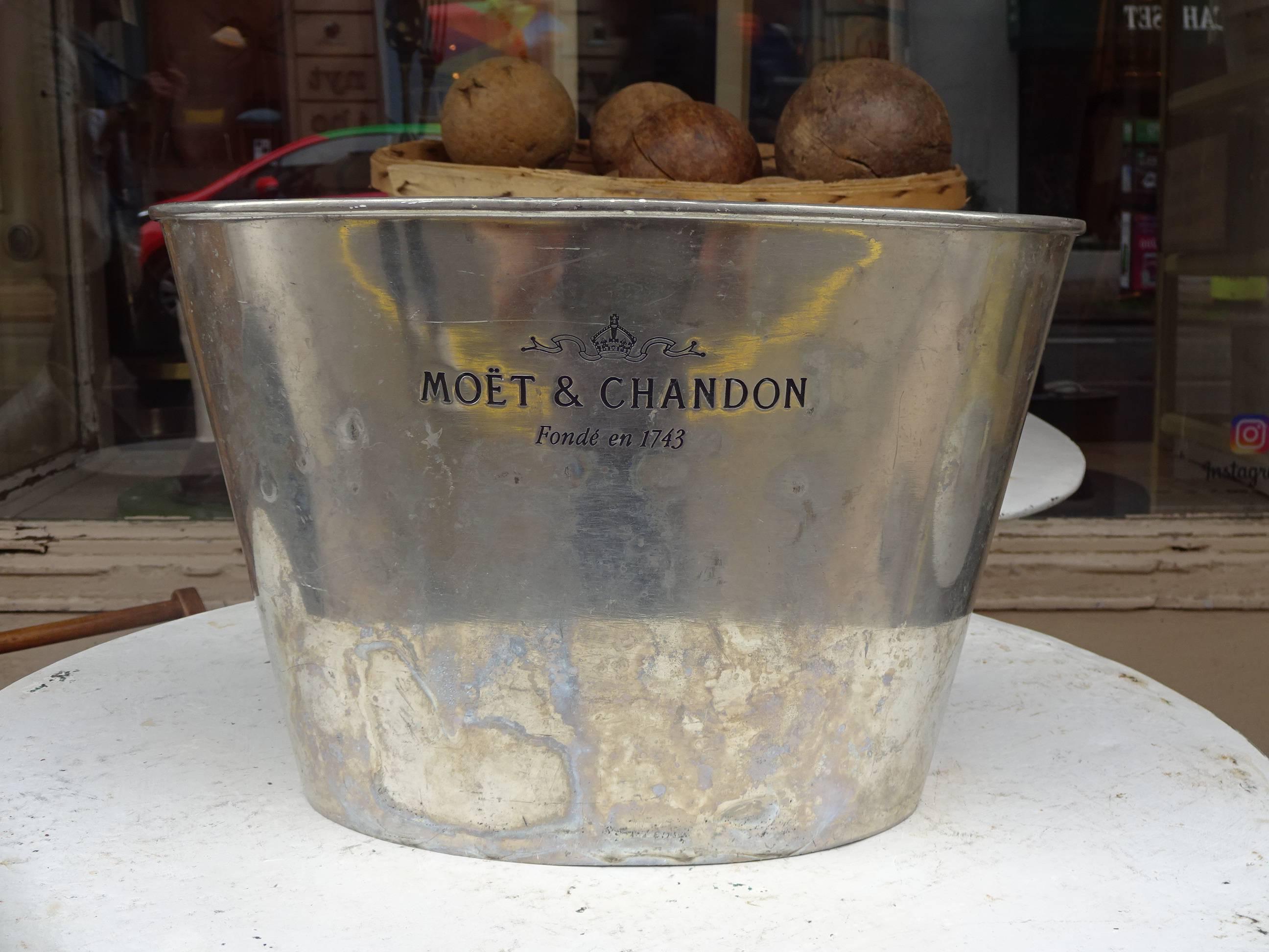 Handsome oval champagne tin cooler / ice bucket from the prominent champagne house Moët & Chandon. The bucket can hold two bottles.

 