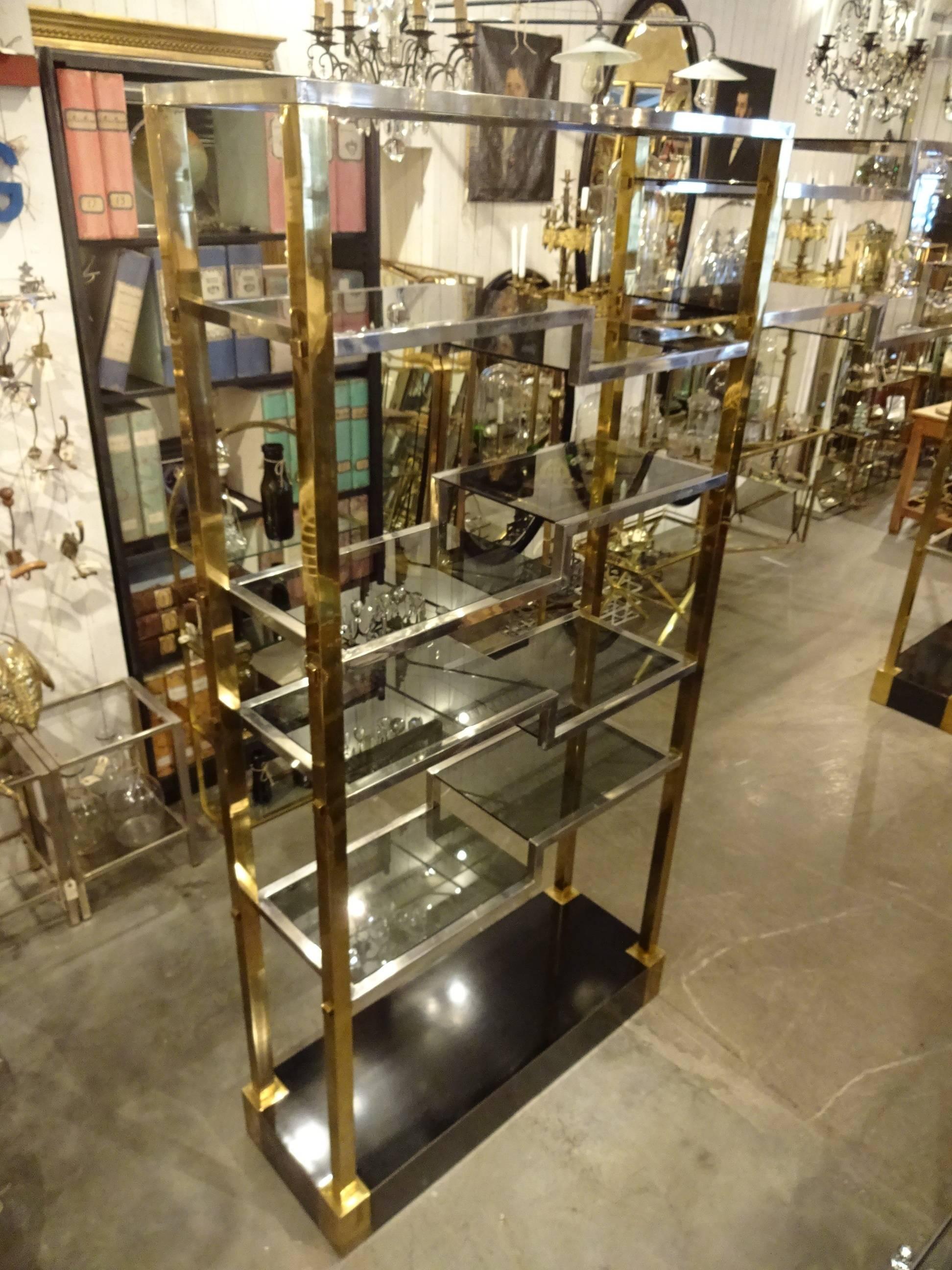 Huge and unique Mid-Century French brass and chrome shelving unit from the 1950s. This gorgeous piece has lovely detailing and consists of two large units united by one long shelving unit. It would be a showstopper in either a shop or a private