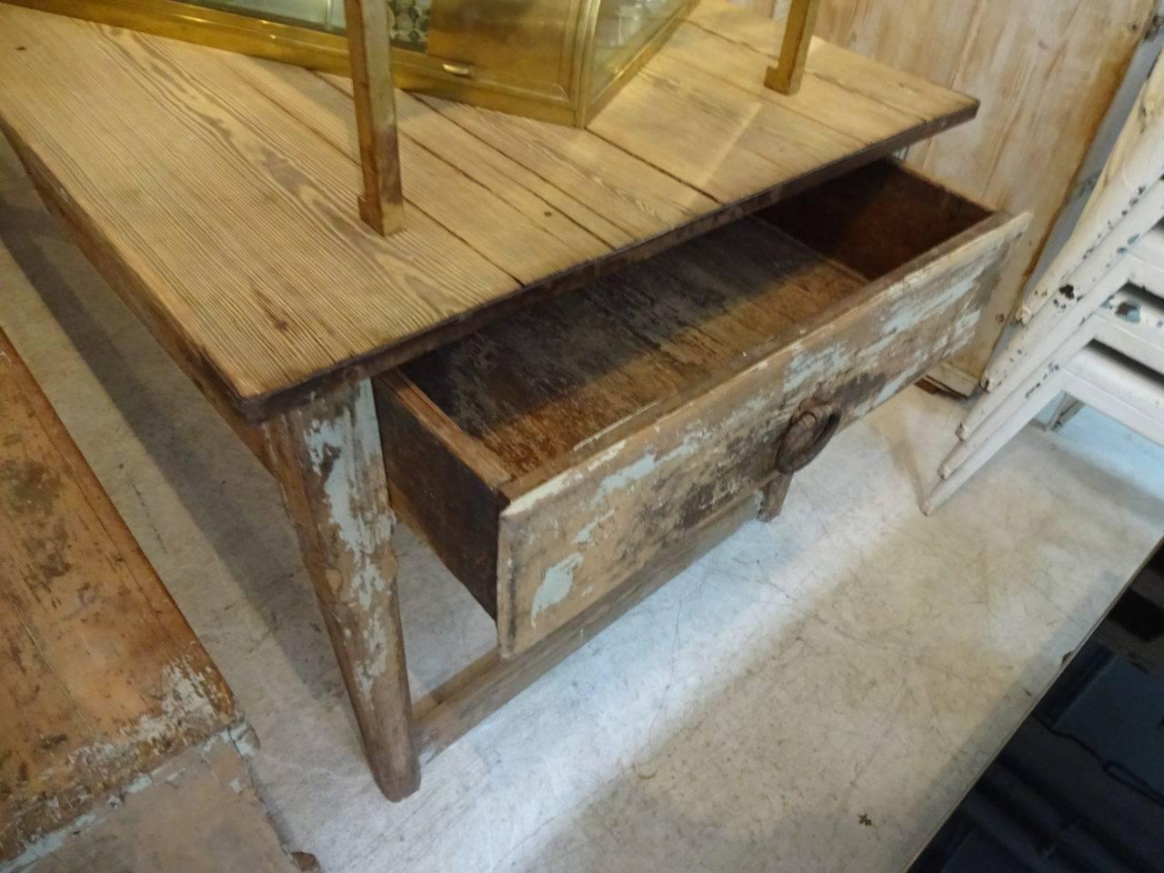 Beautiful rustic vintage rectory table, from the South of France. Stands firmly on six legs and has a genuine luscious weathered patina and a large and practical drawer at one end. The long gorgeous wooden bench belongs with it. This is the longest