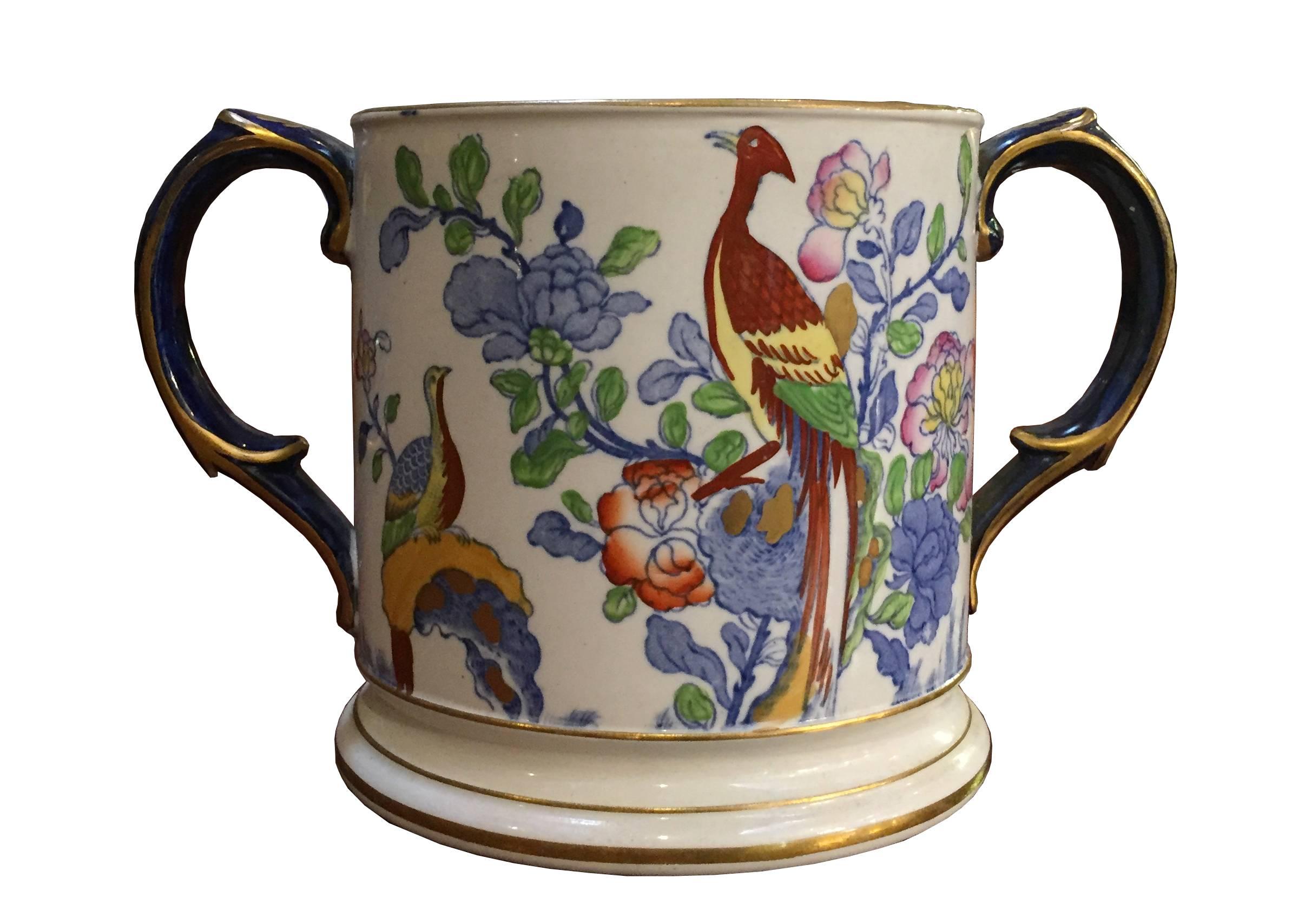 Decorated with flowers, birds and foliage.

Measures: Diameter 13cms
Height 13cms
width across handles 22cms.