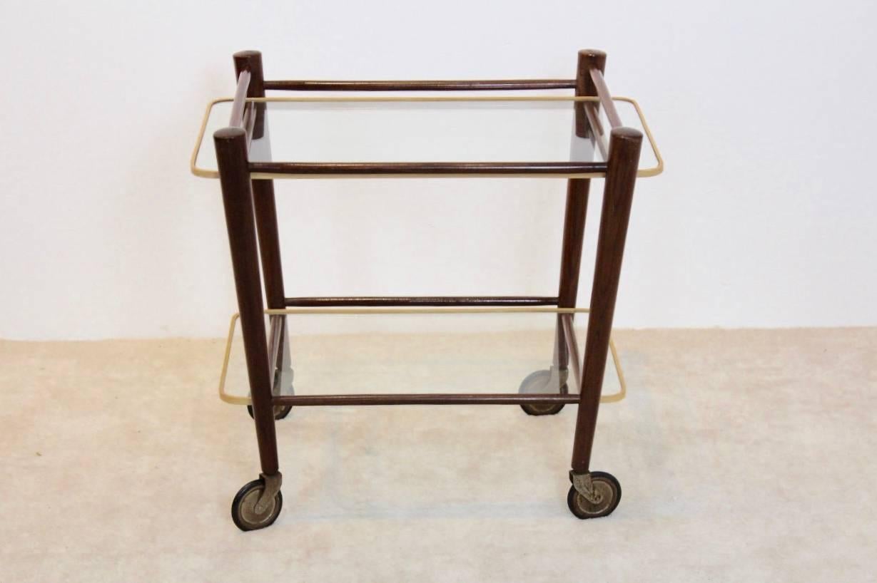 Beautiful serving trolley in totally original state. Designed by Cees Braakman and produced by UMS Pastoe. The trolley has a solid teak frame and glass plates with original rubber protection, one of the first series. The beautiful teak frame has