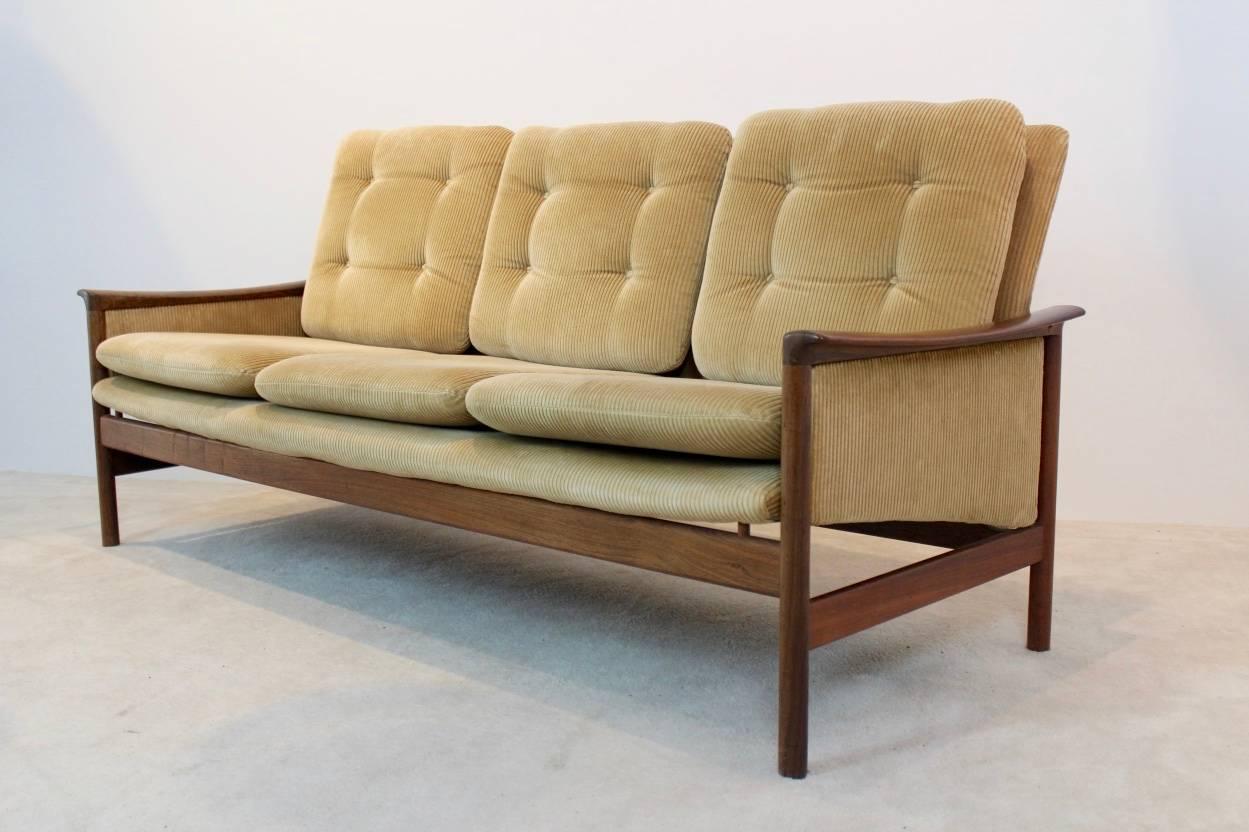 A wonderful and very rare original matching 1950s Norwegian seating group made by L.K. Hjelle Møbelfabrikk in Sykkylven. This amazing comfortable three-seat and three one seat have a brown teak frame and soft olive green rib-cord upholstery in