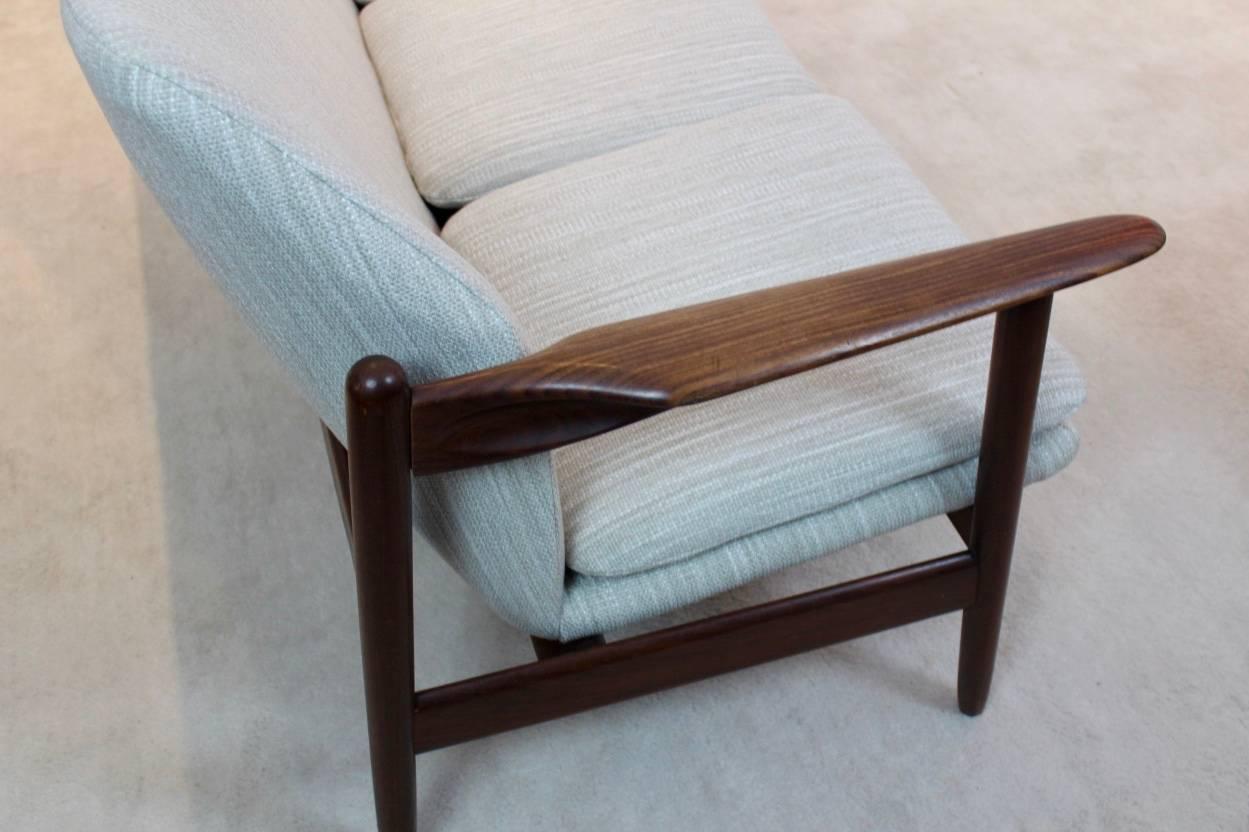 Rare midcentury teak sofa produced and designed by Propos Hulmefa in the Netherlands in the 1950s. So, real early Dutch design. Three-seat sofa in original state with new upholstery and foam in cream toned wool. Very beautiful organic shaped heavy