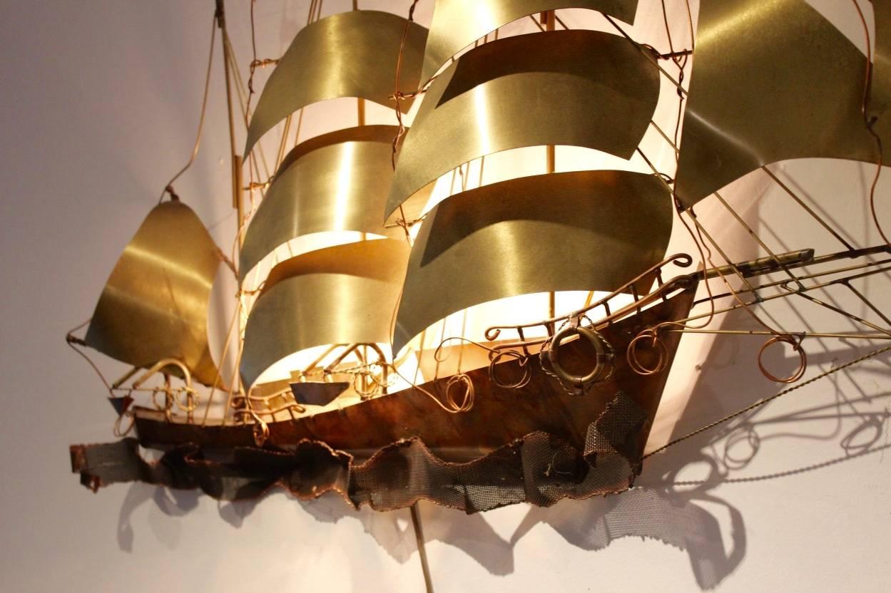 A very rare wall light sculpture in solid copper and brass, designed and made in the 1970s by the Belgium artist Daniel D’Haeseleer. This beautiful sailing vessel comes with two light fittings for an even more beautiful effect. With nice patina and