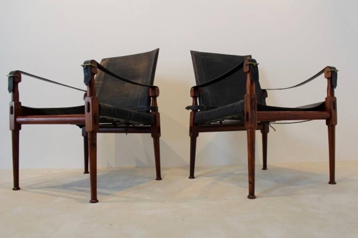 Superb black leather and rosewood set of safari chairs with a beautiful natural patina.
M. Hayat & Brothers produced a lightweight, portable armchair based on the model of the English officers' chairs. This chairs are easy to disassemble without