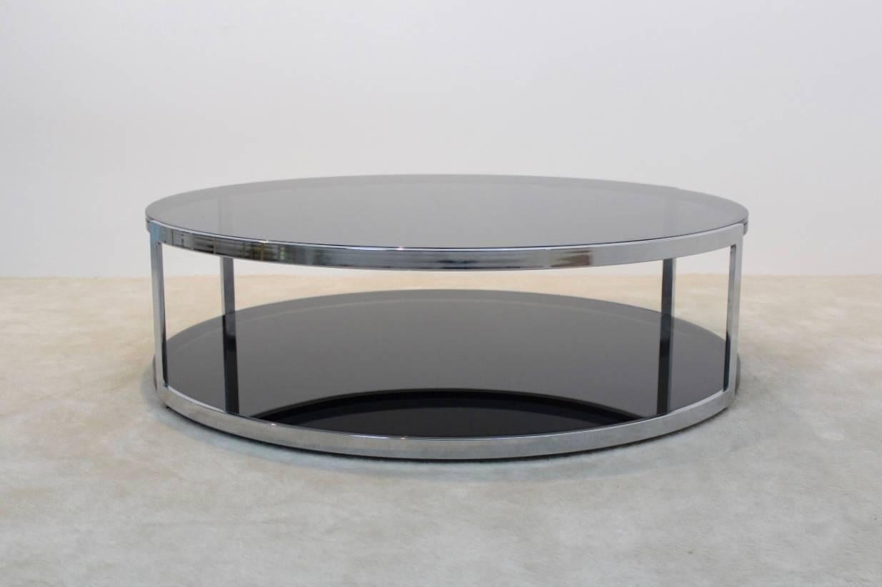 Stunning and whimsical low Belgochrom coffee table with glamorous performance. The heavy metal frame has a total original black finish with Heavily Chromed surroundings. The table is a unique example of the Hollywood Regency style and in excellent