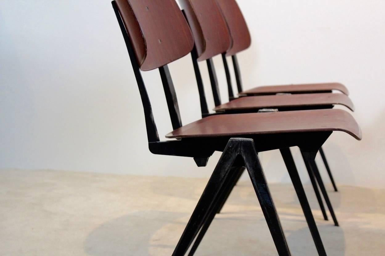 Highly wanted Industrial S16 pagwood stacking chairs by Galvanitas, designed in the manner of famous Industrial designs by Wim Rietveld, Jean Prouvé and Friso Kramer (‘pyramid’ or ‘compass’ base principal ). These Sculptural chairs are made for