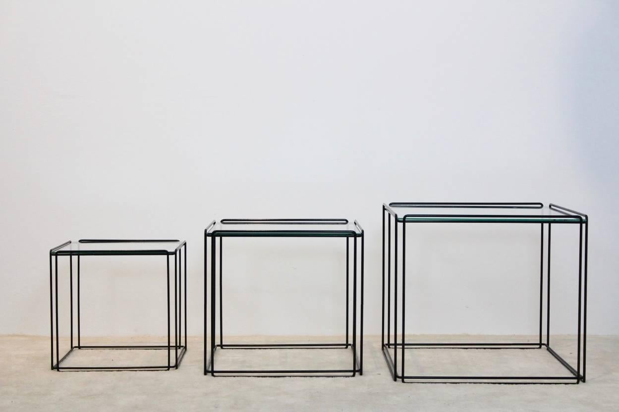 This nest of three Isocele nesting tables originates from France and was manufactured in the 1970s by Arrow. They have a black wire steel frame with glass on top. Designed by Max Sauze and are in very good vintage condition. These Minimalistic