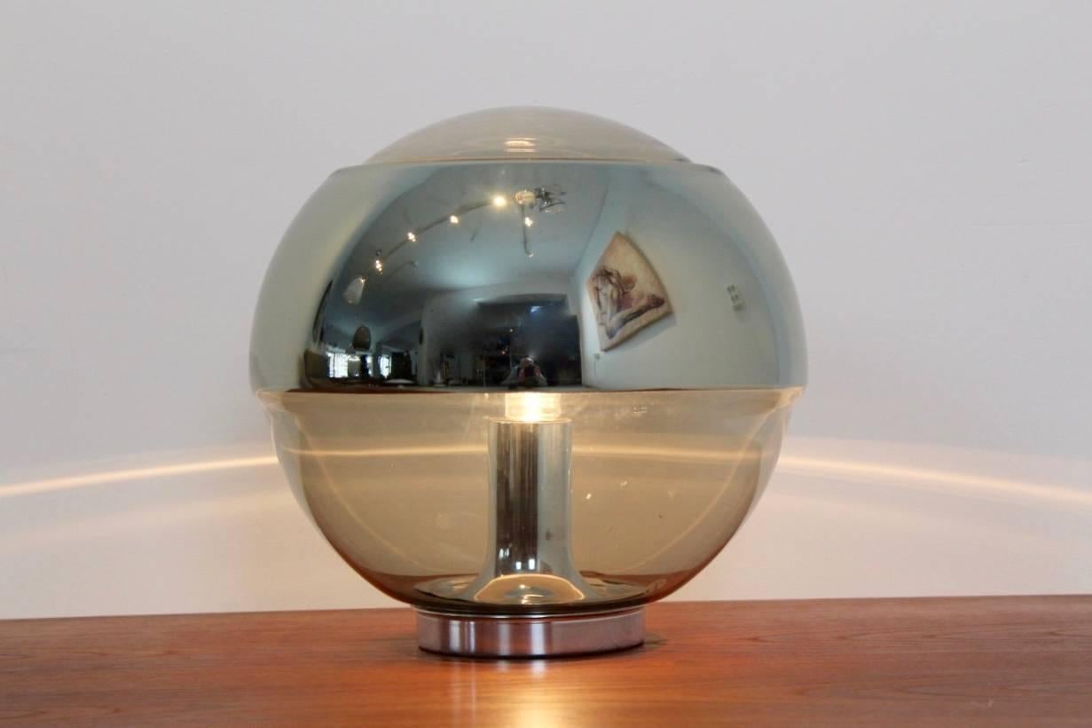 Iconic and rare globe table lamp manufactured by Peill & Putzler. Comes in beautiful handblown glass, featuring a transparent glass globe with a large mirrored band to avoid light glare. Chromed base and fitting. Made in Germany, lamp is labelled.