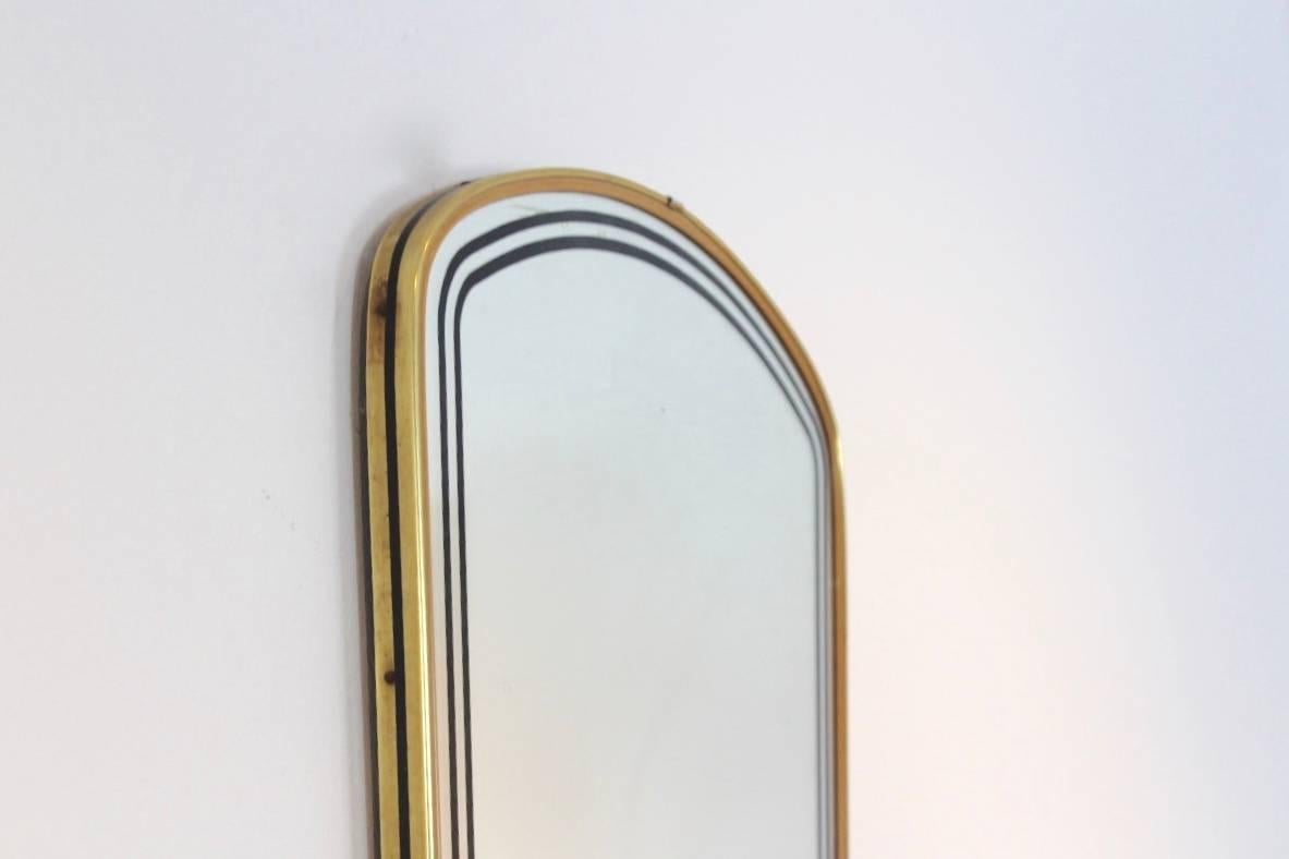 Beautiful brass framed mirror made in France. Very elegant with a beautiful and unique black lining in the glass and in very good condition.
    
