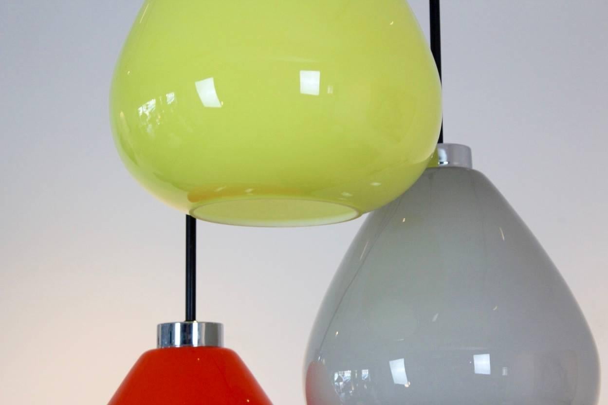 Sophisticated and rare Murano glass pendant lamp. Produced by Venini glassworks in Murano in Italy in the 1970s. Very beautiful handblown opal Murano Glass in thee colors. Very beautiful citrus yellow, amazing grey and tasty orange. With a small