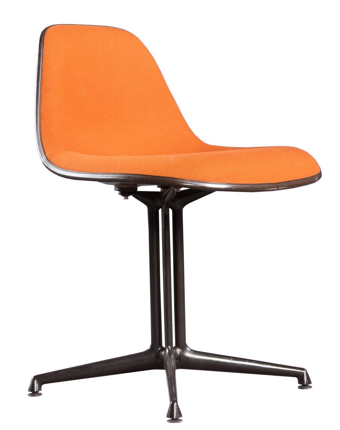 Model La Fonda chairs designed in 1961 by Charles & Ray Eames produced by Vitra for Herman Miller. 

The chairs have a fiberglass shell with original orange colored hop stack upholstery and the iconic La Fonda base. Underside marked with sticker