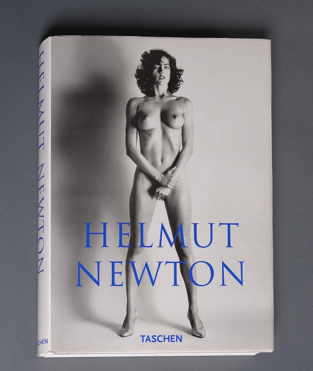 Taschen collectors`edition 06414/10000 signed by Helmut Newton with stand designed by Philippe Starck.
This is the biggest and most expensive book production in the 20th century. It is the limited edition of 10,000 copies worldwide, each signed and