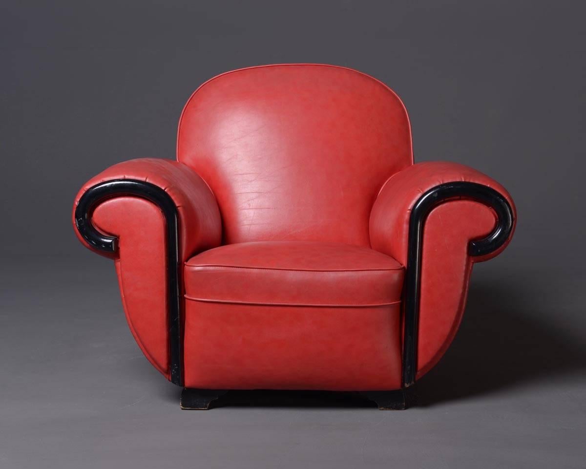 Very comfortable armchairs, Art Deco style. Covered with red skai leather, wooden parts lacquered black.
Measurements: W ca. 130 x D ca. 82 x H 85 cm; SH 40 cm
Condition: vintage, good.