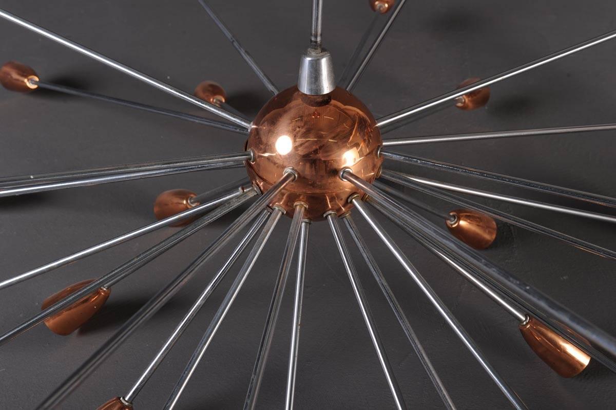 Impressive and large Sputnik ceiling lamp in the style of Stilnovo, 1960s. It has 30 lamp sockets (E27) made in copper arranged around a copper bowl.
Material: chromed metal, copper, porcelain sockets
Measurements: diameter 130 x height 100