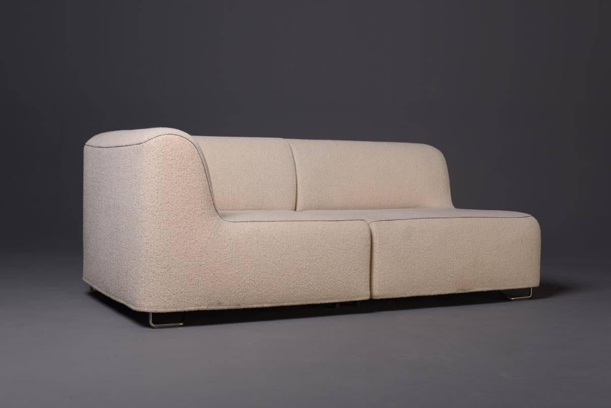 Chaise longue with referring pouf by Piero Lissoni for Cassina, 1996. The piece consists of two separate pieces which can be assembled to one chaise longue; completely upholstered with the original fabric in off-white, small metall