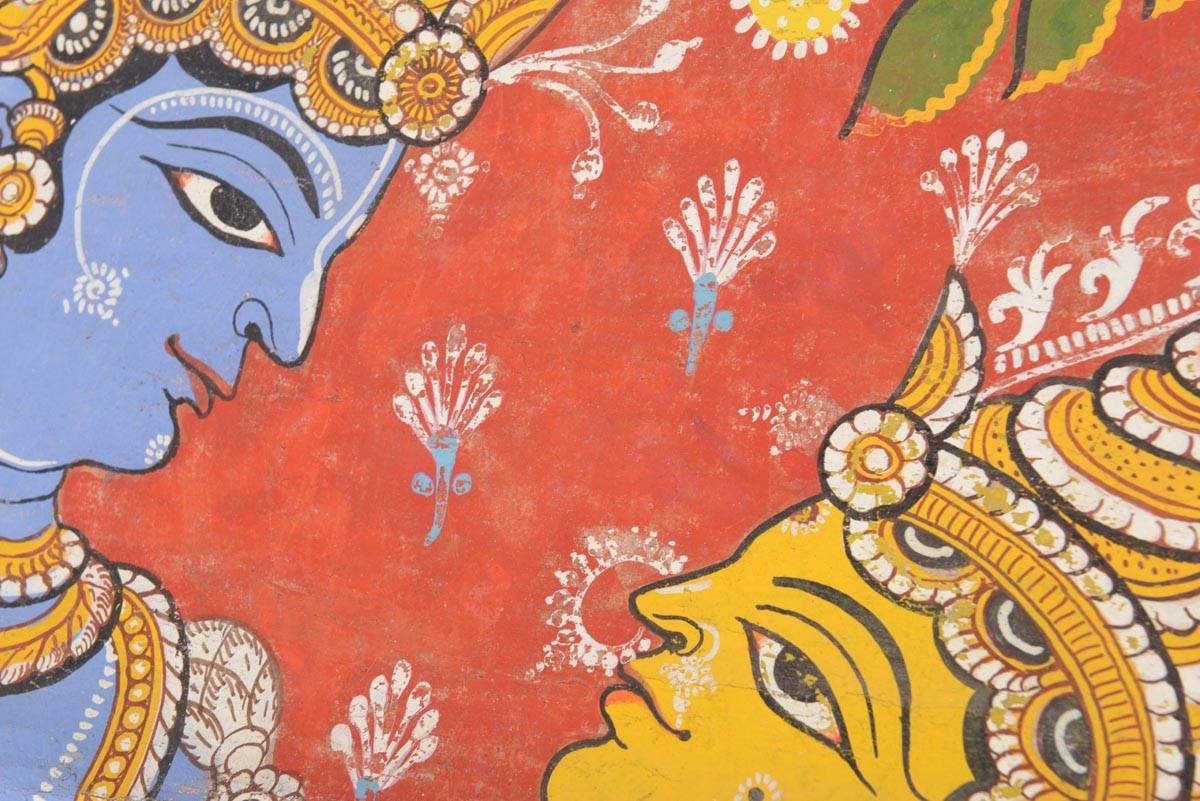 Large hand-painted, rolled painting of Radha-Krishna, the divine couple. They are emblematizing in Hinduism the connection of the female (Radha) and the male (Krishna) aspects of the personified god. The theology of Gaudiya Vaishnava sees Krishna as