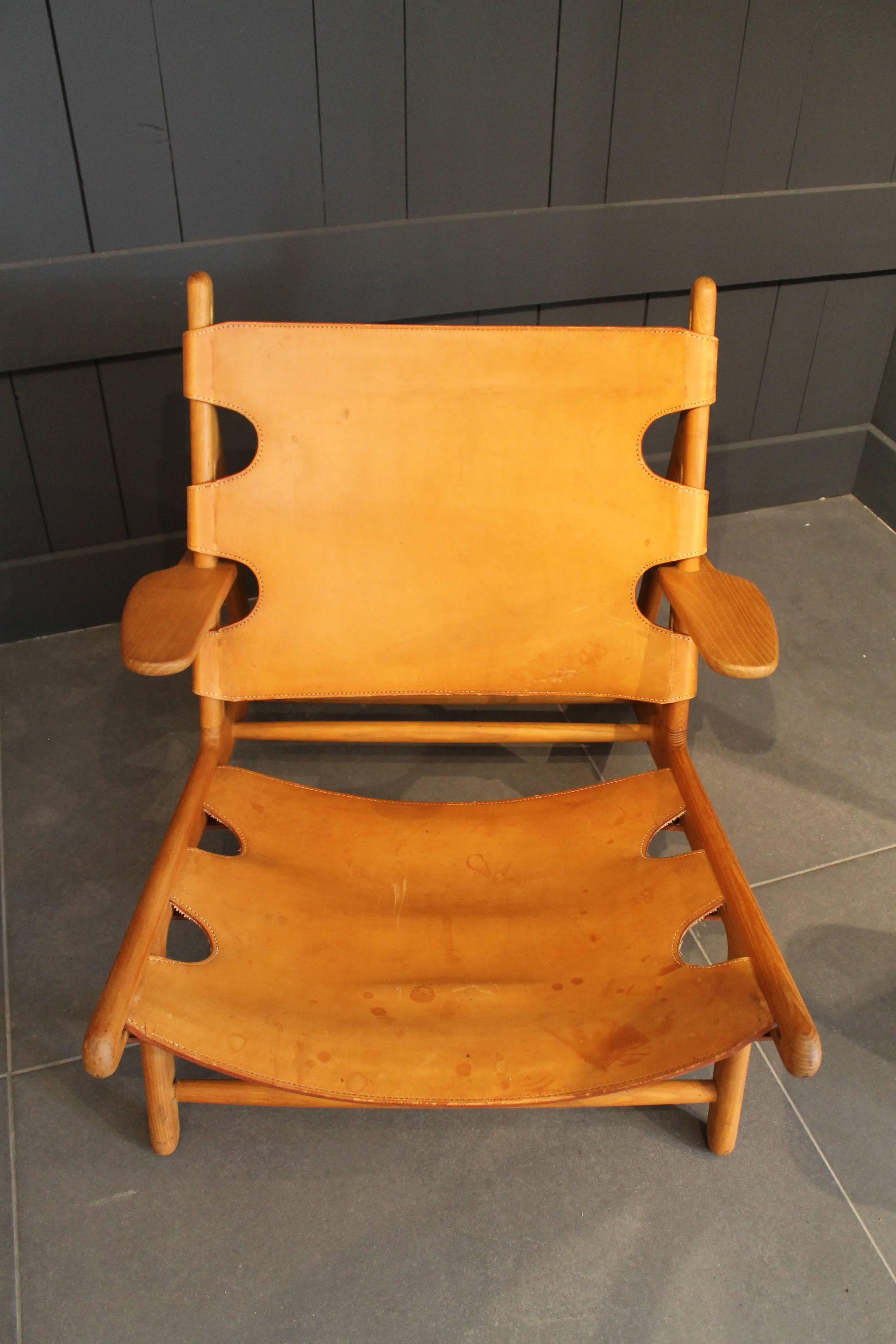 A chair of Børge Mogensen hunting lounge chairs for Fredericia, Denmark. Designed in 1950 for an exhibition of the Copenhagen cabinetmakers' guild.

Among the great mid-20th century Danish furniture designers, Børge Mogensen distinguished himself