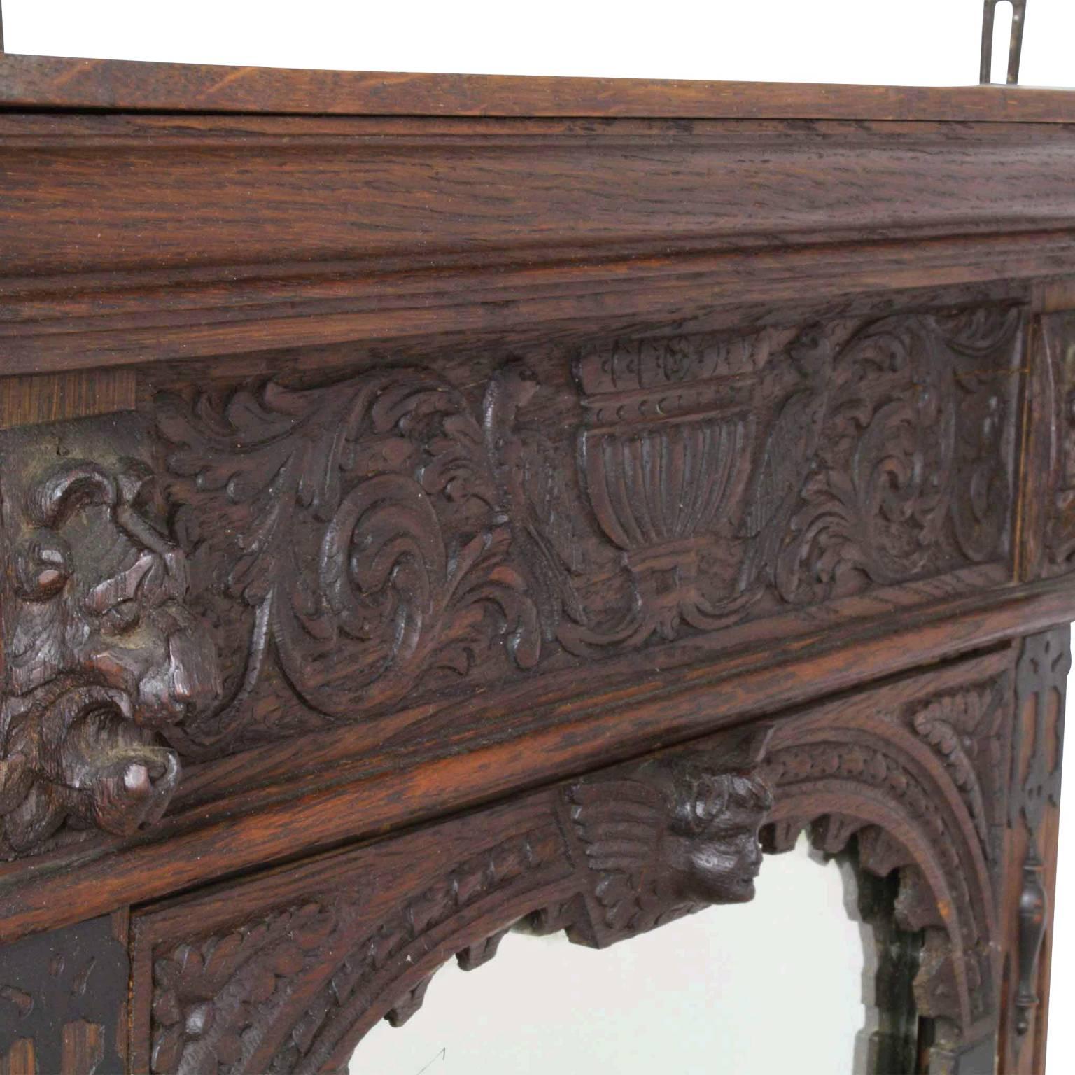 Features nicely carved lion’s heads and urn with ivy under the crown, as well as a cherub’s head with wings. While intricate, this piece has a more toned down feel than many of the typical pieces in this style. Complete with shelf and small storage
