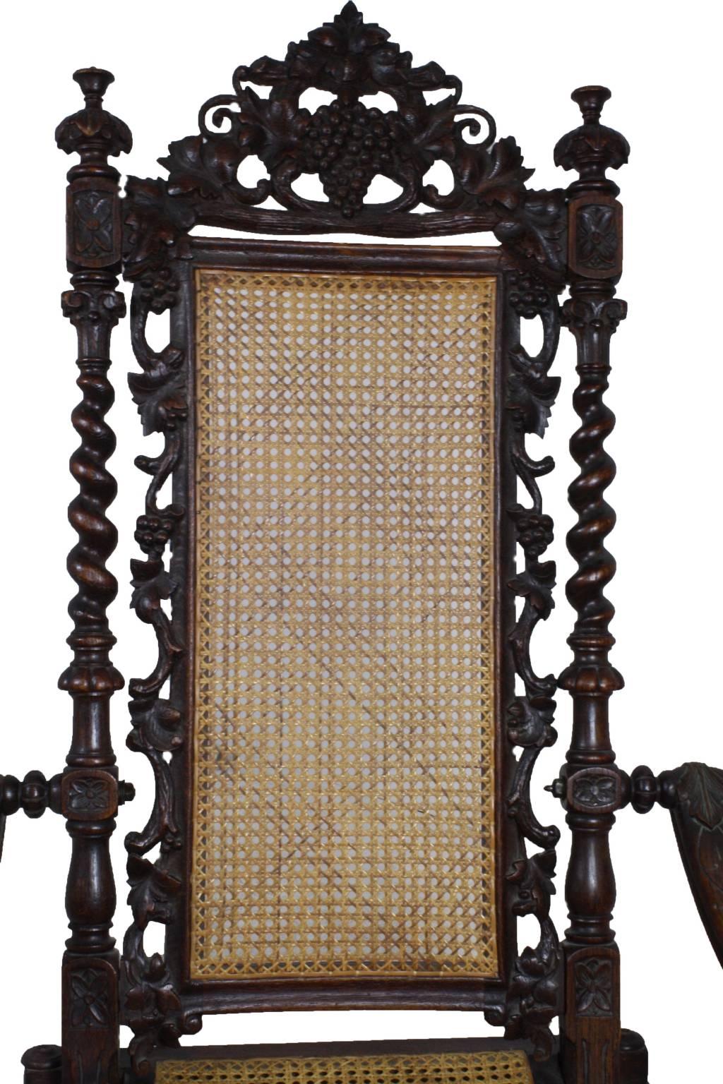 This rarely seen style of hunt chair has a unique folding design. It has a feel much like the folding lawn chairs or lounge chairs of today, with a high back and a low seat. The caned seat and back are in excellent shape, with ornate carvings
