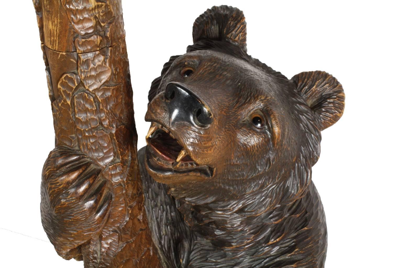 An excellent example of turn of the century Brienz Swiss carving in linden wood. There are many Swiss carvers well known for carving certain subjects and Seilar-Brawant is known for bears. Standing at over six feet in height with a lovely beveled