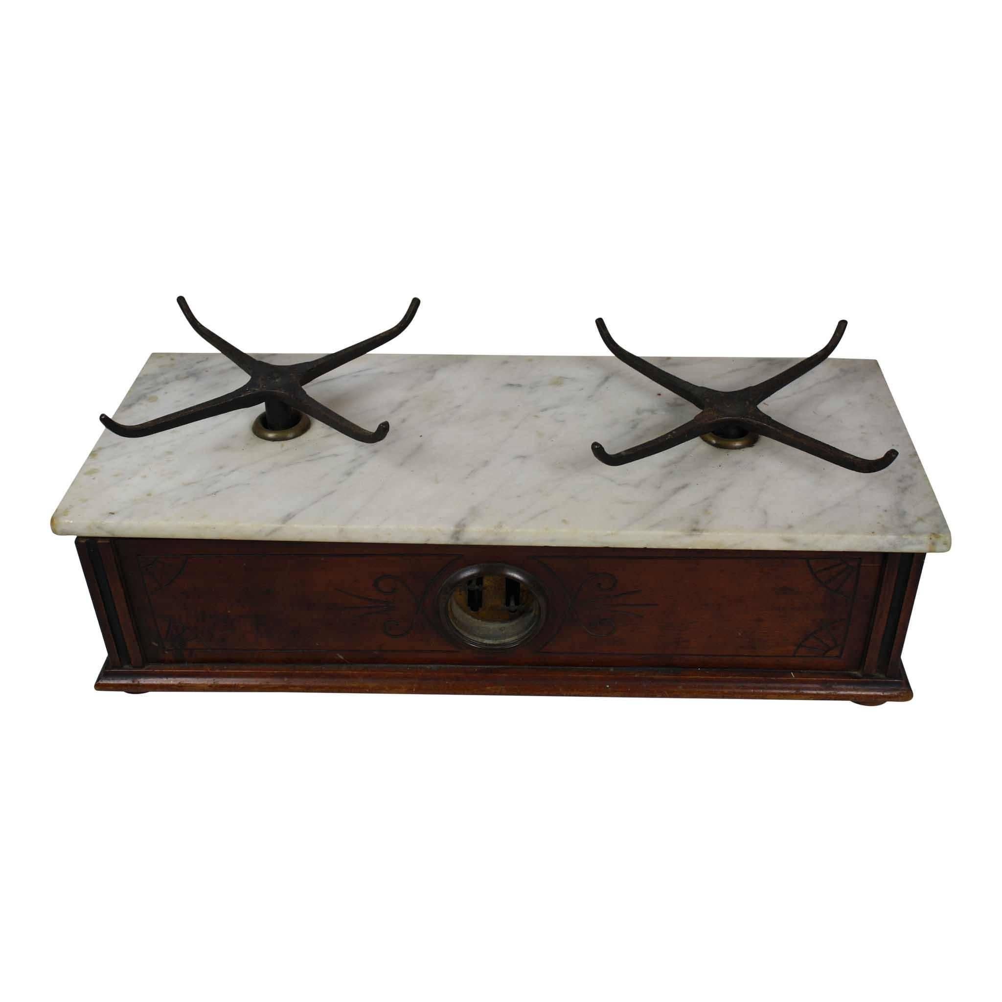 Well known balance maker, Henry Troemner, from Philadelphia crafted this marble top scale. It was made prior to his death, likely between 1844 and 1852. It has the original two brass pans which are supported by four arm iron holders. The pans are 9