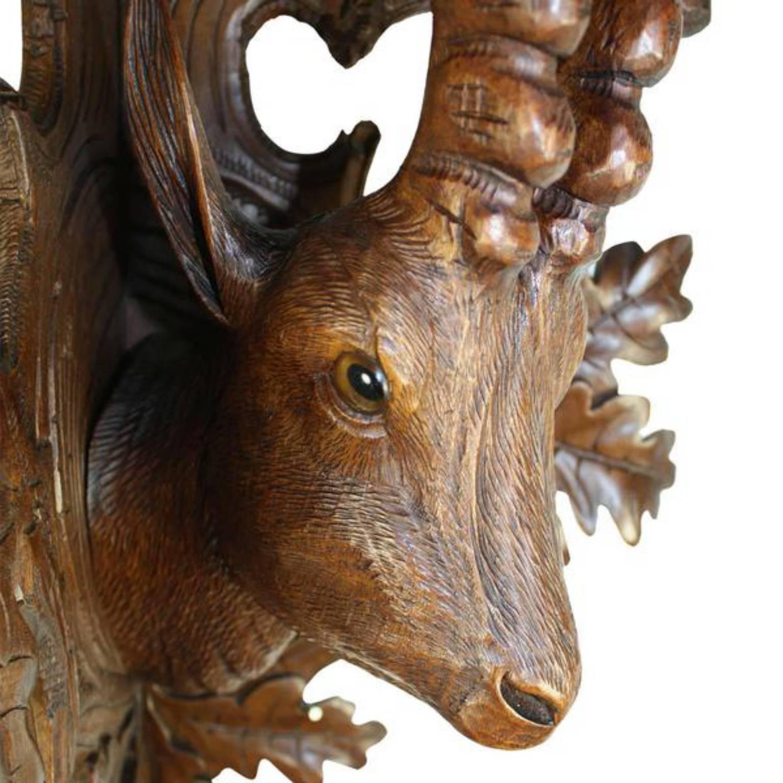 The Ibex, once abundant in European mountain ranges, has become rare in many areas. This shelf, supported by a black forest carved ibex, depicts the goat like head.  Linden wood, that lends itself so well to carving, shows the detail of the soft