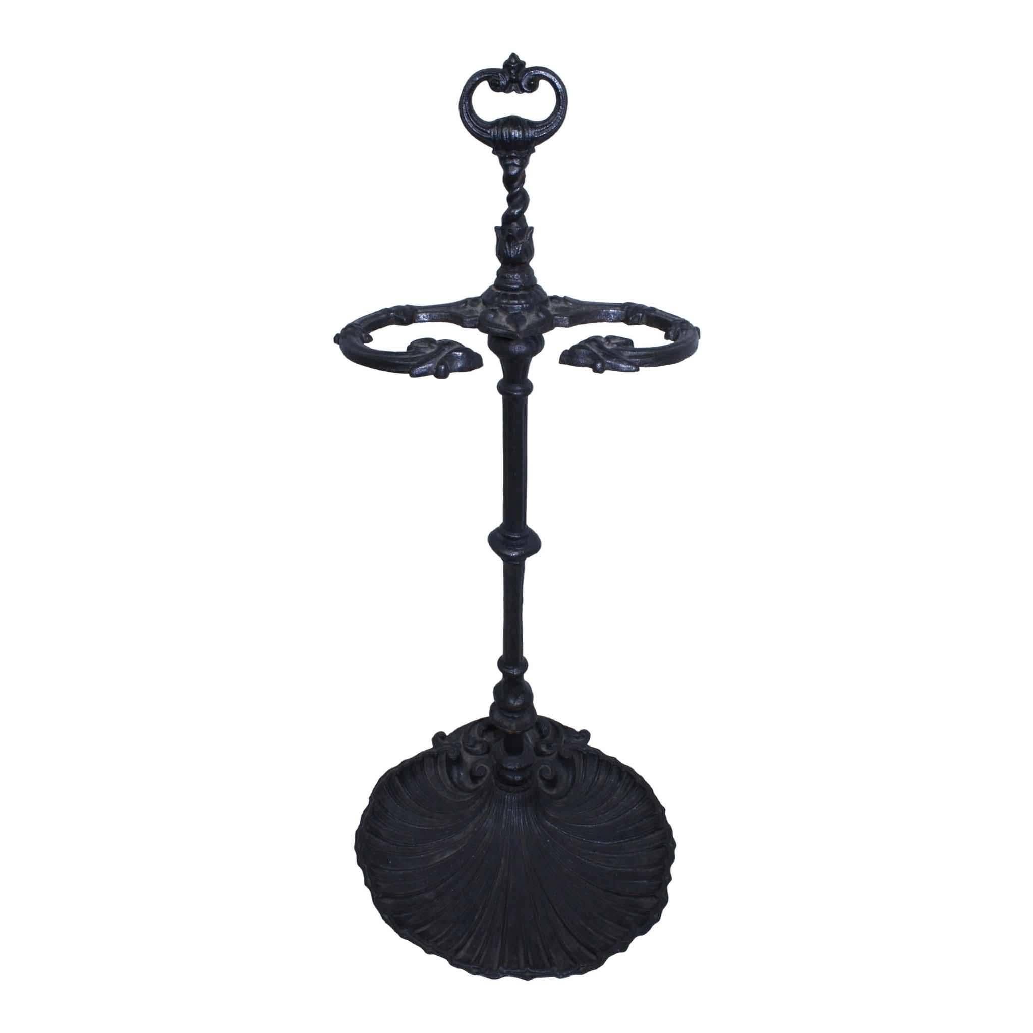 Add to the charm of your fireplace or hearth with this four piece antique set of three tools and a cast iron Stand. The tray of the Stand is the shape of a sea shell. The shovel, poker, and tongs have a matching turned top with a different finial on