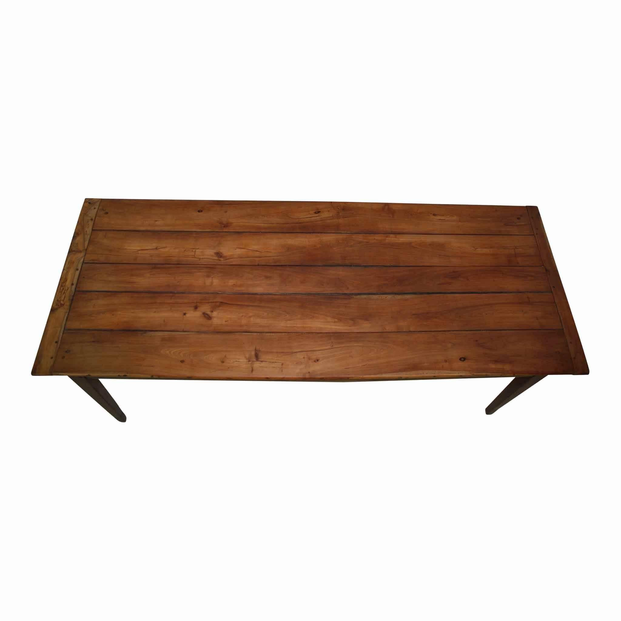 This beautiful table is constructed of a cherrywood top with oak apron and legs. The table has one deep drawer and one faux drawer. Risers have been added to the table legs.