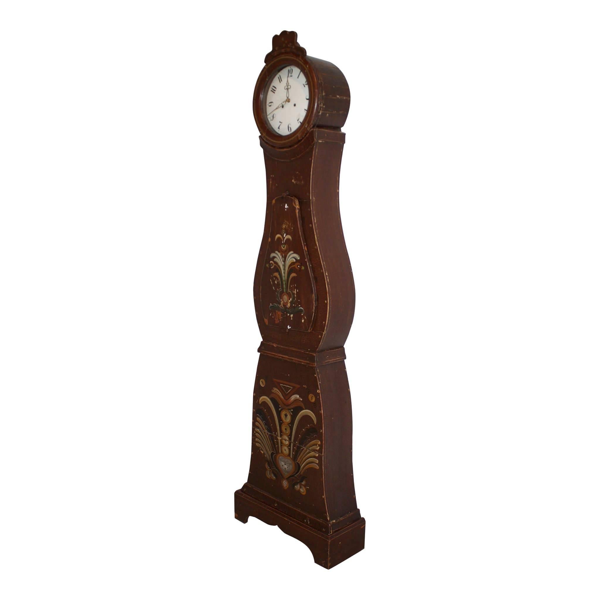 This Mora is crowned with a trilobe crest above the clock face, which is covered with convex hood glass. The face has a 10.75 inch diameter. The original clock movement has been replaced by a battery driven movement. The paint is original with a