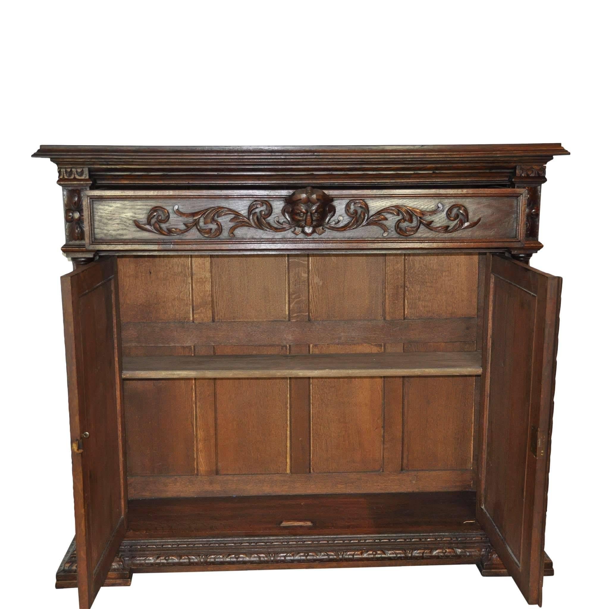 On offer we have a French cabinet carved in a traditional style, where this cabinet stands out from other French cabinetry of its type, is the turned pilasters flanking the cabinet drawers.