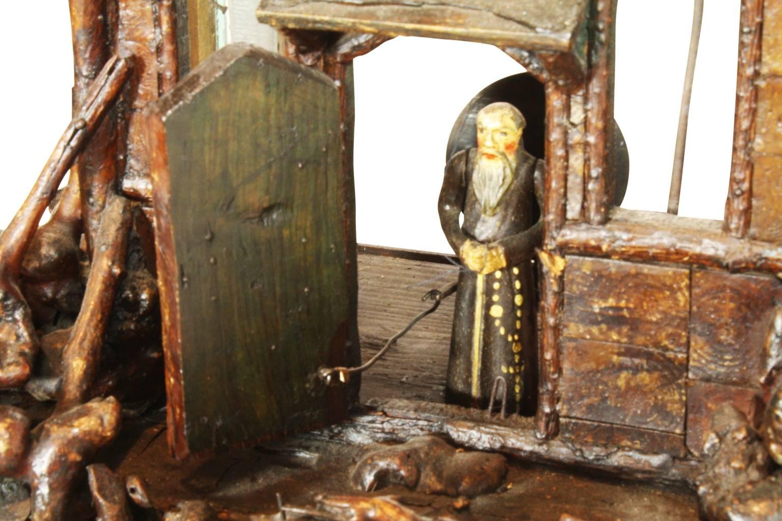 This charming piece features a unique and quirky burled root base. The church door opens on the half and full hour to a Monk ringing the church bell in the tower above. His arms and the bell move in unison with the chiming of the clock.
    