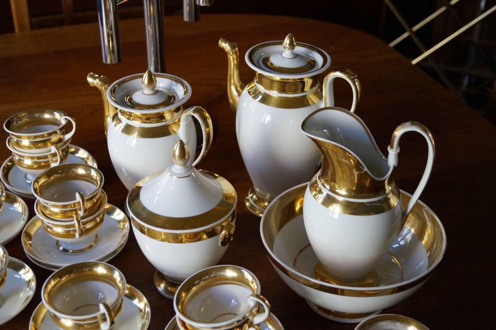 Good condition, some wear on gold and two cups have little damage.

Measures: Bowl 20cm-height 10cm.
Sugar bowl 12cm-height 20cm.
Coffee pot-height 26,5cm.
Teapot-height 24cm.
Jug-height 20cm.
Cup-diameter 8.5cm.
Saucer-diameter 13cm.