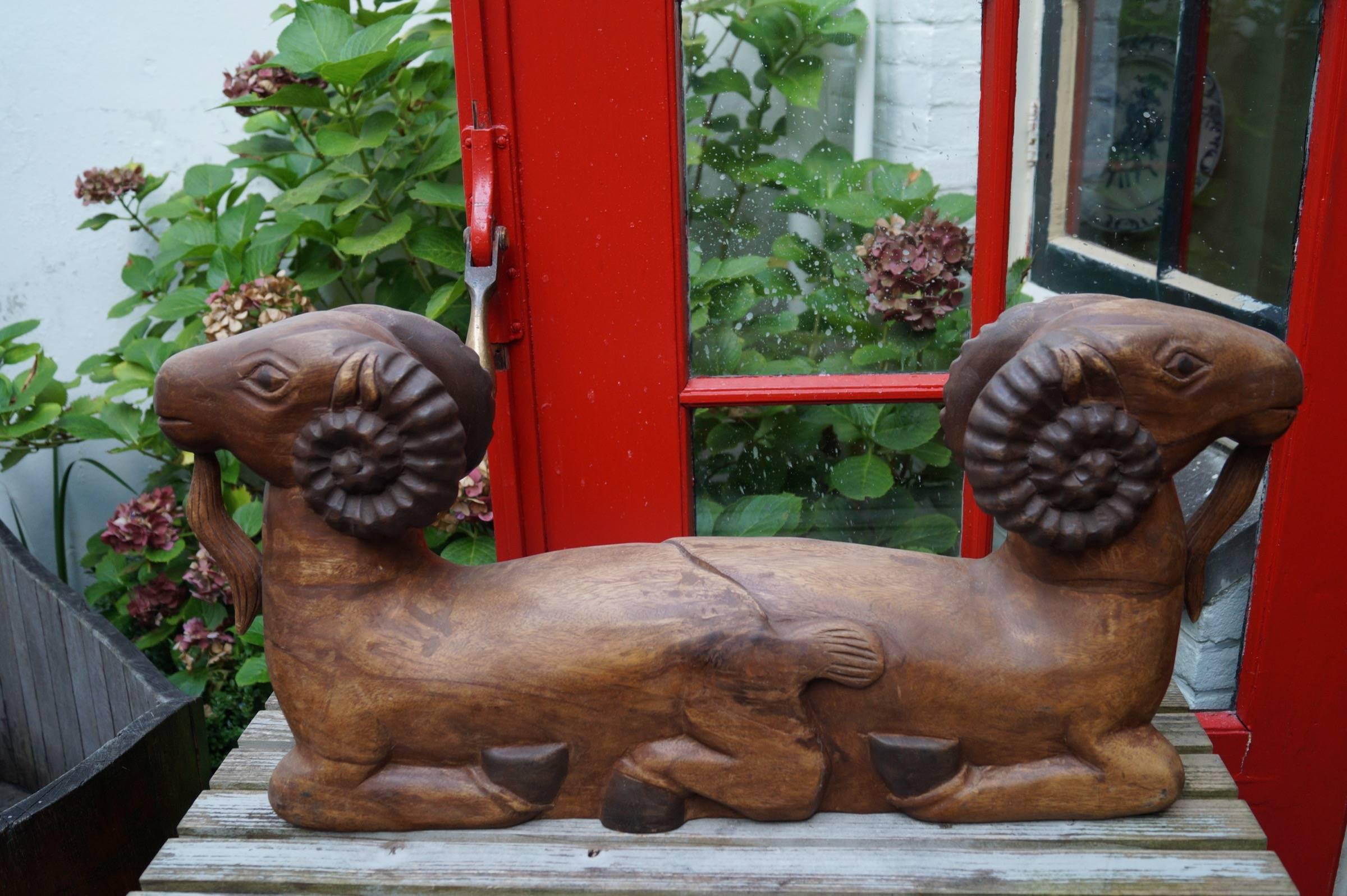 Strong butcher shop sign.
Beautiful wooden sculpture of two rams used as a shop sign for a French butcher, France, circa 1900-1920.
Measures:
H x W x D: 35 cm x 77 cm x 15 cm.
                    