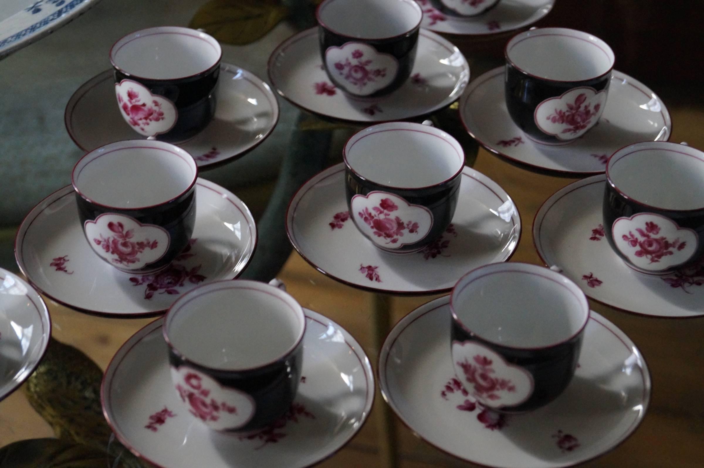 This Nymphenburg porcelain demitasse cup and saucers were produced in Germany in the late 19th century.
The set is designed in a elegant Chinese style. The colors used are black and magenta. The flowers are hand-painted.

Measures: 10x Demitasse