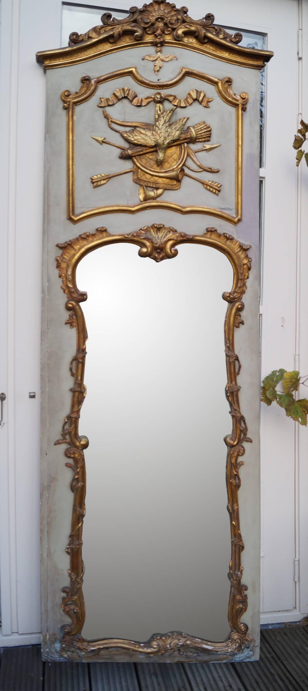 Rococo Mirror
18th century French hand-carved gilded trumeau or over mantel with hunting decor

Beautiful and rare mirror. Hand-carved and gilded on a blue grey wooden background.
France Rococo 1730-1760.

Good condition. Wear on wood, gilding