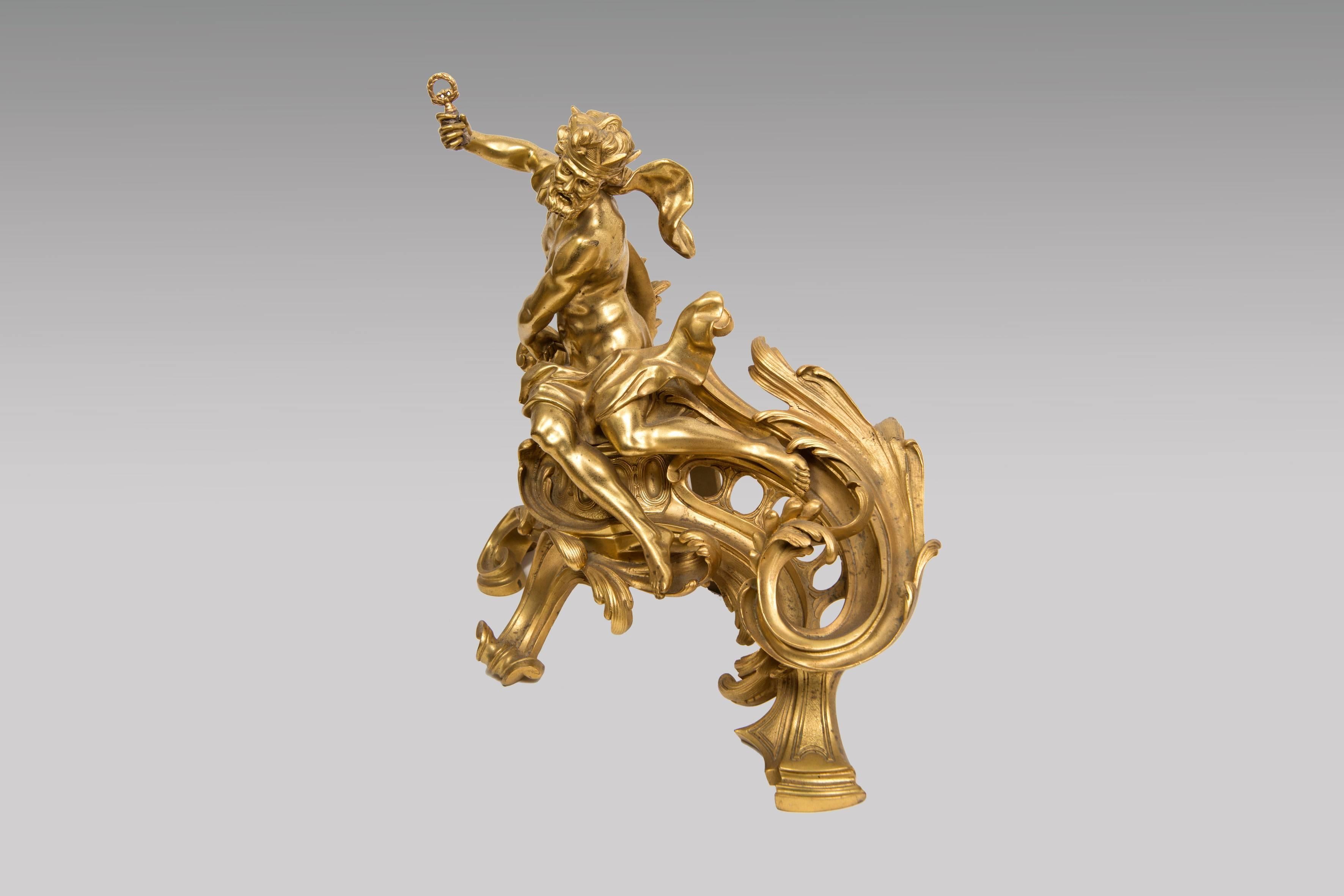 Exceptional pair of andirons In gilded bronze scrolls to de foliage decor from Neptune. Reproduced in the reference book by François Linke (1855-1946). F. Linke founded his studio in 1881 and moved Vendôme in 1900, when he received the gold medal