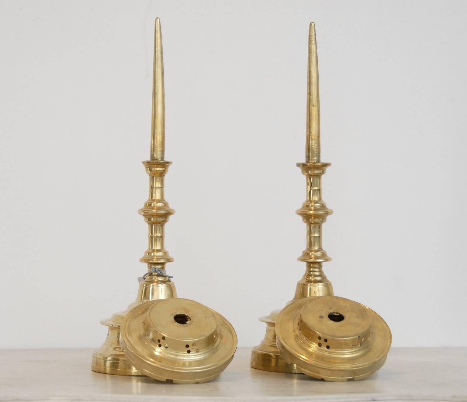 A pair of very fine Flemish pricket brass candlesticks, from the 15th century.