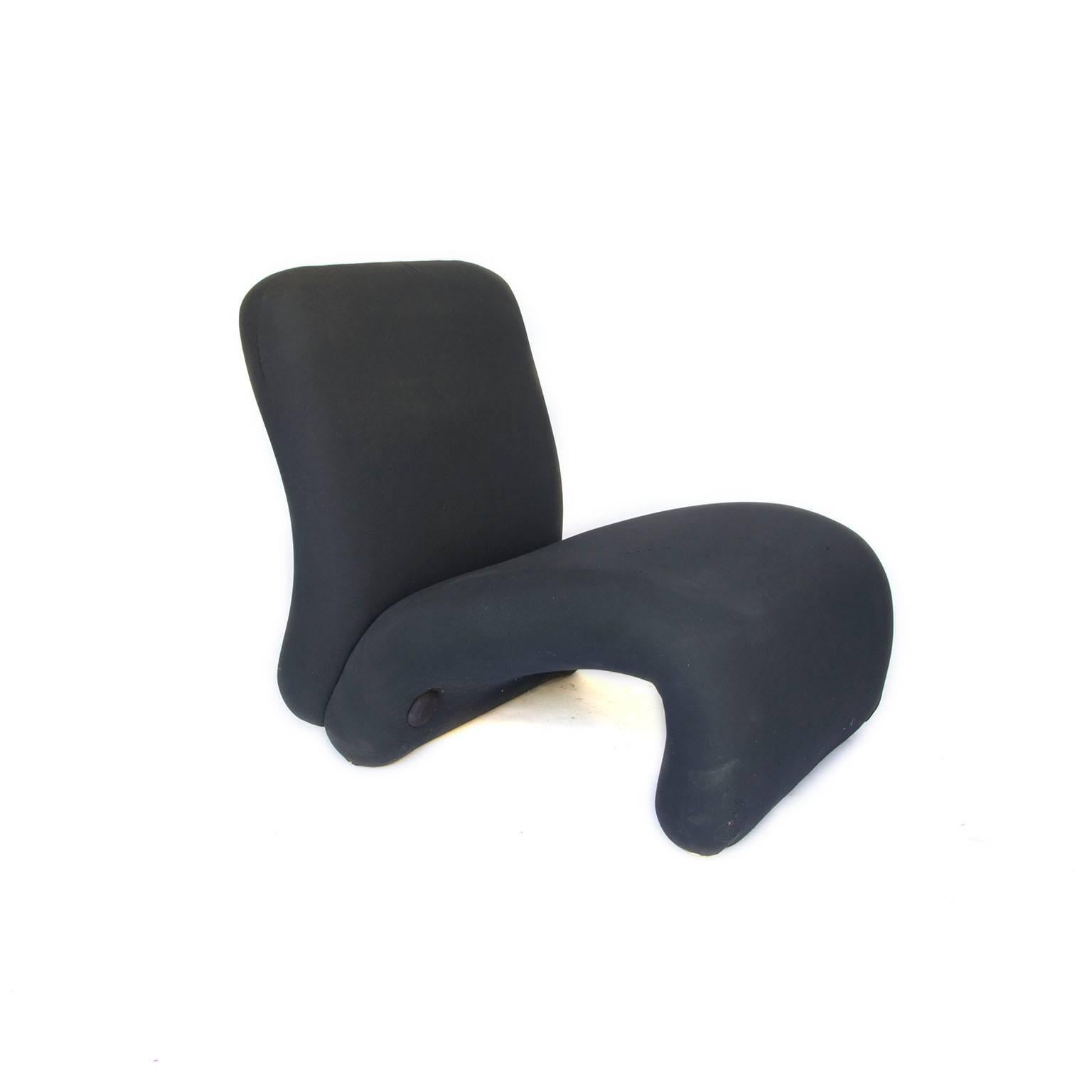Set of lounge chairs in original black stretch fabric, very comfortable because of slightly flexible base.

On request reupholstery is possible in any kind of leather or fabric of your choice. Please ask for more information and the many
