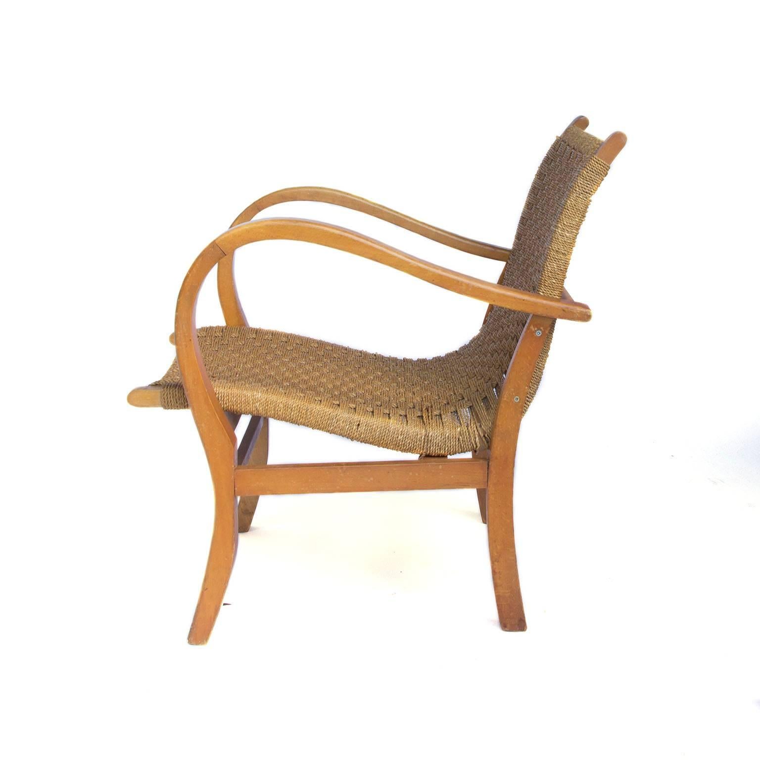 Rare, in those days limited edition very comfortable nice easy chair in rope and wood for the recent bankrupt Dutch Giant Warehouse Company Vroom & Dreesman.

Free shipping for Amsterdam, Haarlem and IJmuiden for lamps, chairs, small items as tables