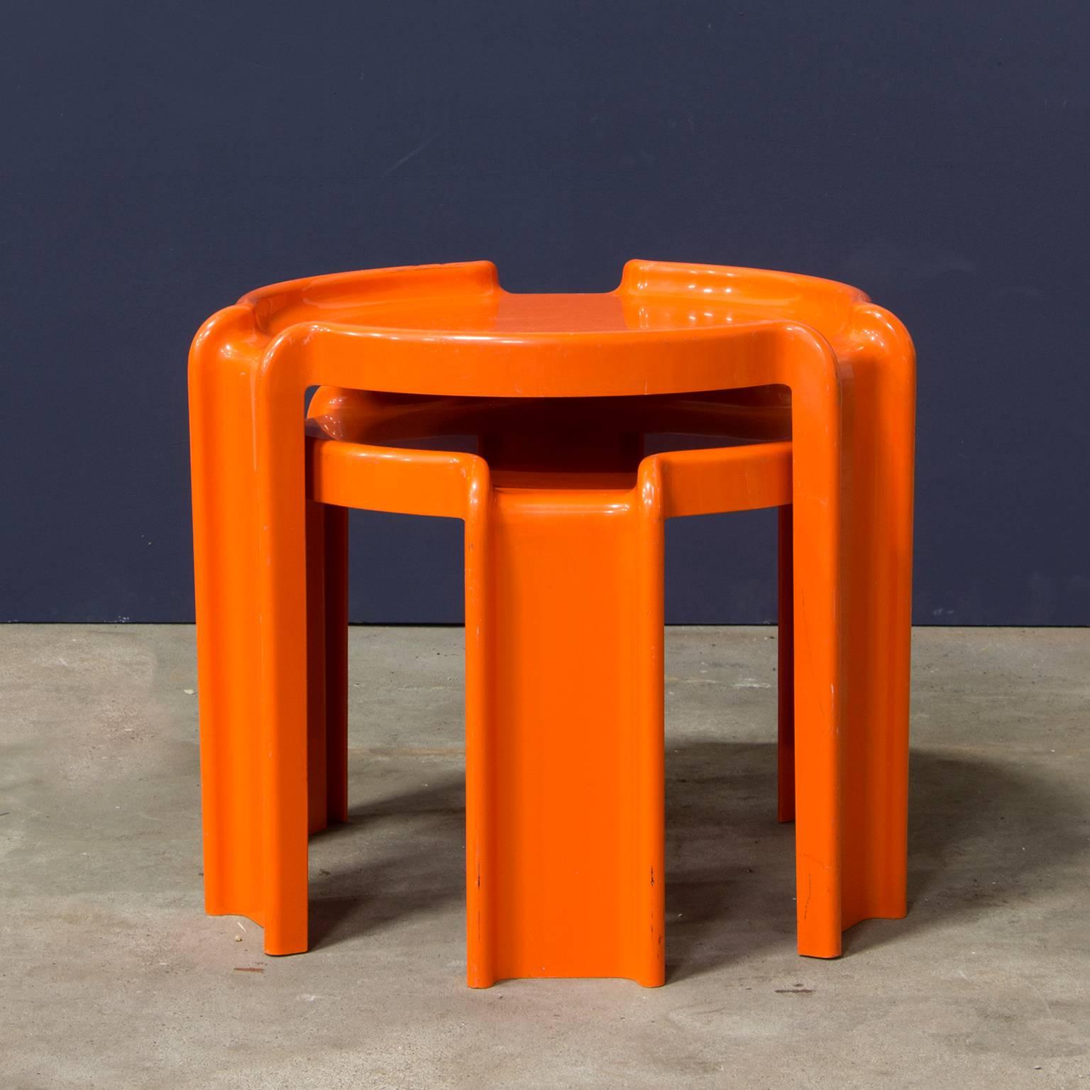 Set of two orange Kartell stackable side tables.
Beautiful bright color. Both tables have some traces of wear and a bit of paint on the rim. The smallest table has a little crack (#8).

Measures: Height of highest table 41 cm.
Height of lowest table