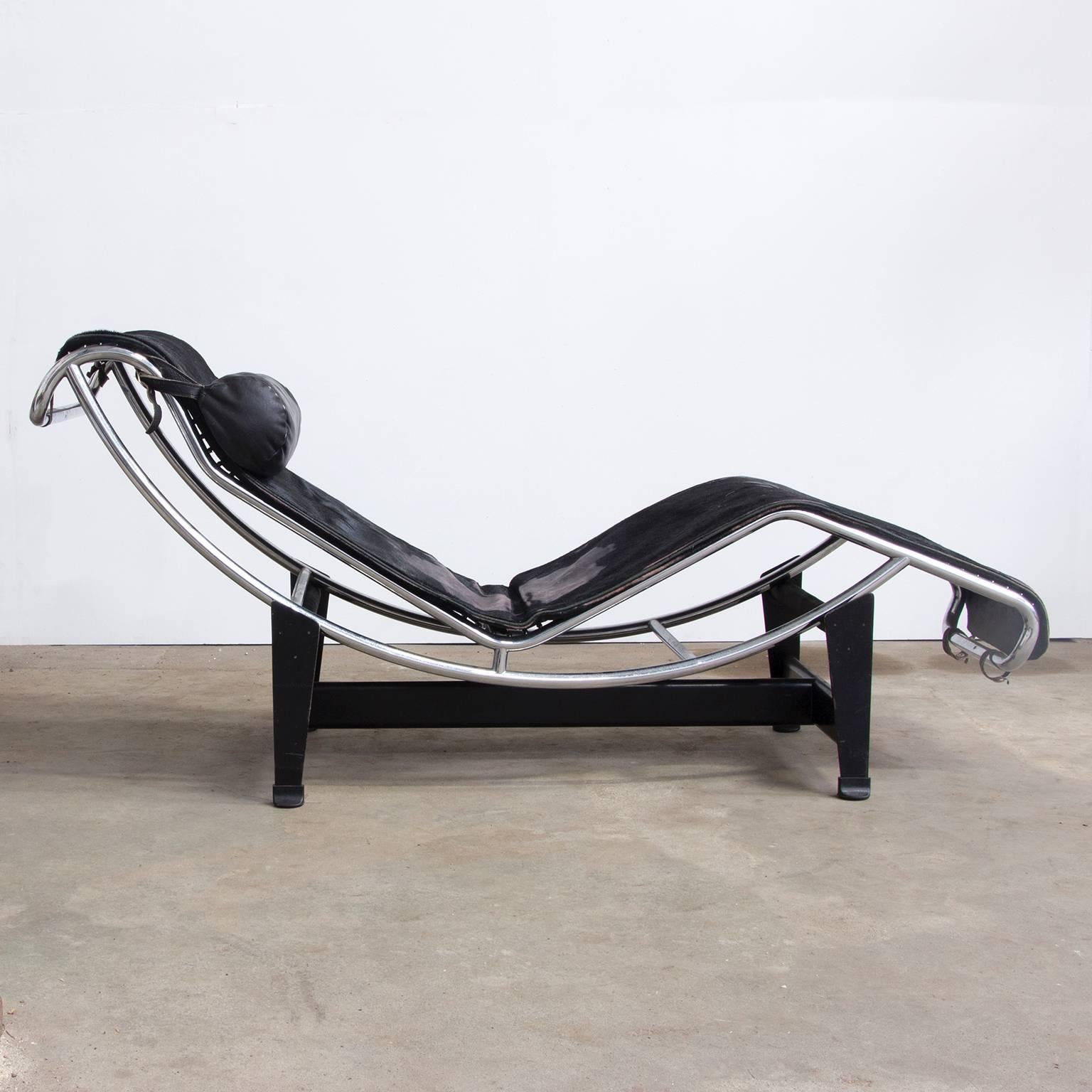 Le Corbusier LC4 chaise longue for Cassina with adjustable polished chrome-plated steel frame and innovative self-supporting mattress, covered in original and wonderful patinated black pony fur.

Some spots with loss of ponyhair. 
Frame in very good