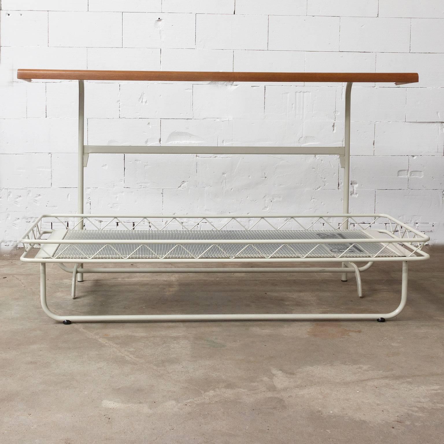 Please ask Casey Godrie Ibiza/Amsterdam for our competitive shipping quote.

Fold-away bed by Rietveld. Elegant design. Some traces of wear like some loss of paint of the bed and some minor stains on the wood. The bed can be sent de assembled; the