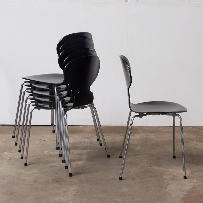 Set of six Ants in black. The chairs are not all produced in the same year (see picture #9 and #10) and are (spray) painted in black but had other colors originally. They are in fair conditions but some have more traces of wear likes some scratches