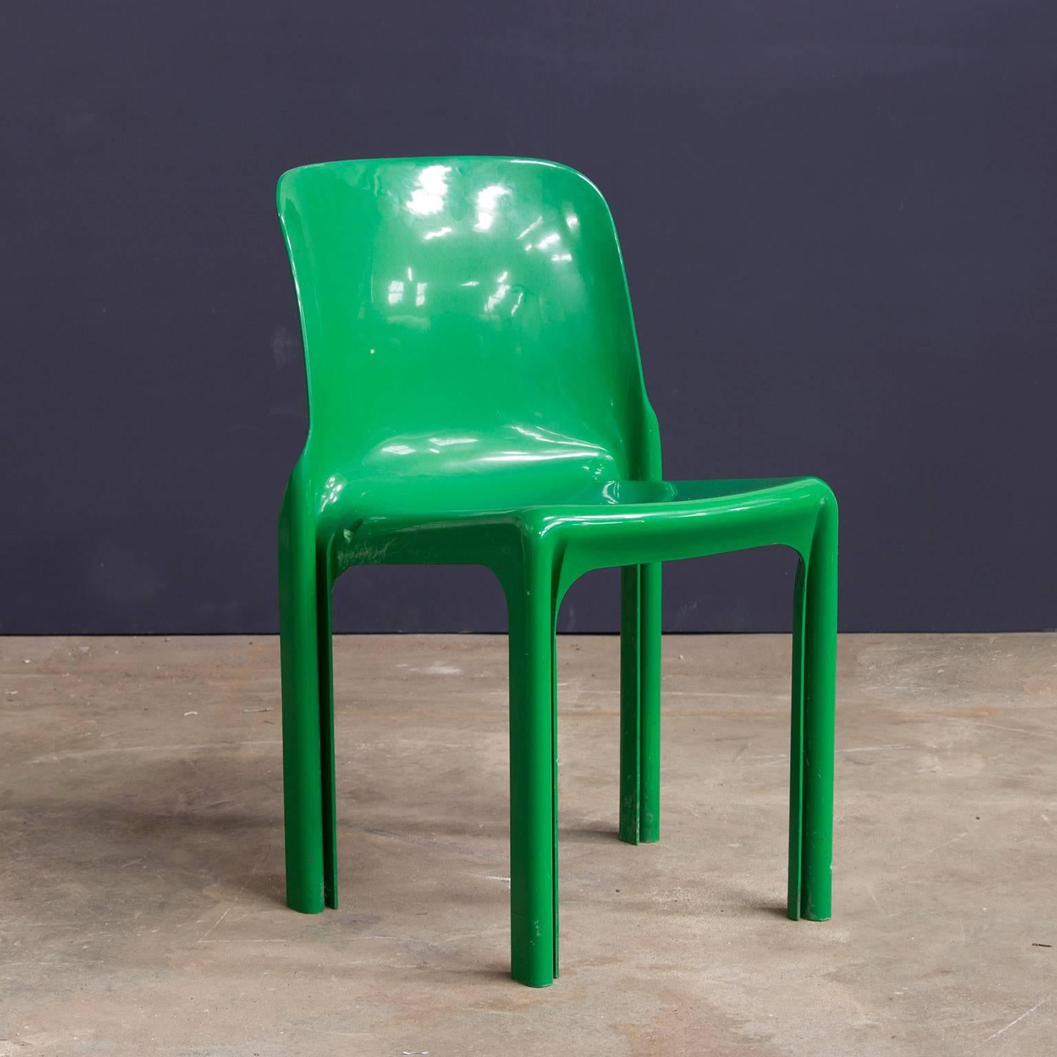 One piece or set of four or six green stacking chairs. Beautiful design. Some scratches on the side caused by stacking. Small damage at some chairs, like a little loss of color or slightly chipped.

Also available a matching white table by Vico