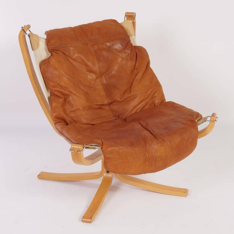 Hard to find 1970s Sigurd Ressel Falcon chair with footstool; designed by Sigurd Ressel for Vatne Mobler in circa 1974. Material: Plywood, canvas, brown leather and metal, chrome-plated. Considering its age this of vintage footstool is still in very