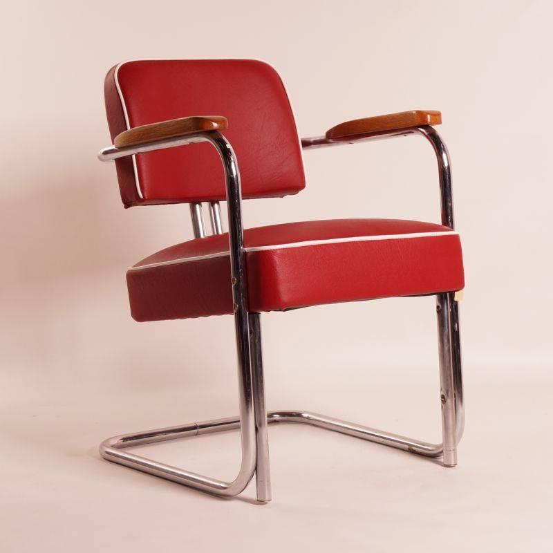 Tubular chair with legless frame by Bauhaus, 1930s. Characteristic chair reupholstered in the original colors; red with white piping. The seat is very comfortable to sit in. The seat height is 45 cm. Origin: Belgium.

The seat and back are fully