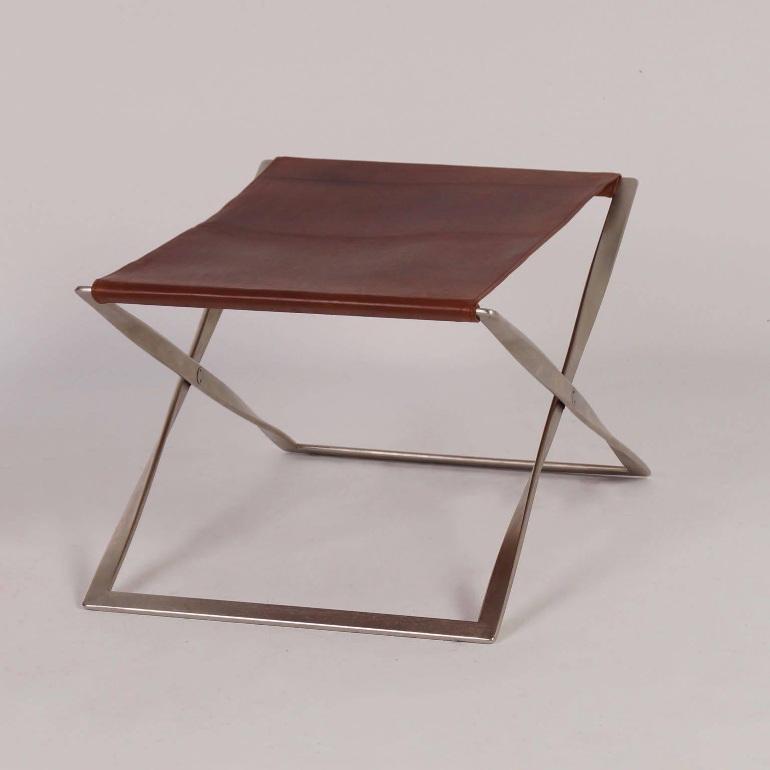 Rare PK 91 stool designed by Poul Kjærholm for E. Kold Christensen A / S Denmark in 1961. Given the age of this stool it is still in very good condition. The seat has been re-upholstred once with brown leather. Material: Metal, mat chrome and