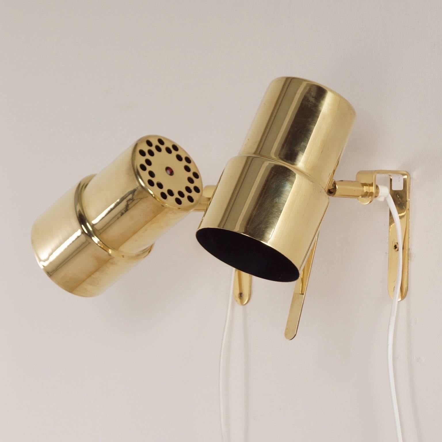 Adjustable brass wall or bedside lamps designed by Hans Agne Jakobsson for AB Markaryd, Sweden in the 1970s. Given the age of the Swedish lights are still in original and very good condition, minimal wear. The lights are cleaned, polished and the